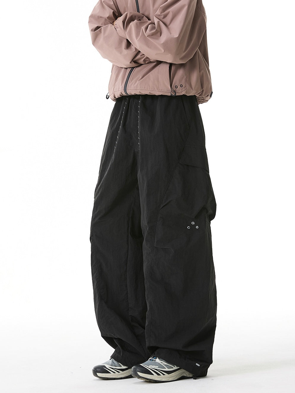 Black windproof cargo wide-leg pants with utility pockets.