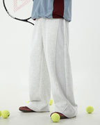 Loose straight leg casual pants in neutral color, high waist trousers for men.