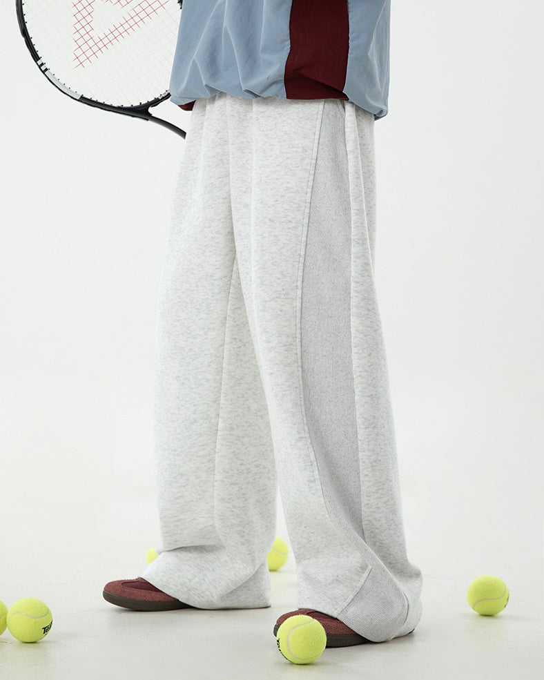 Loose straight leg casual pants in neutral color, high waist trousers for men.